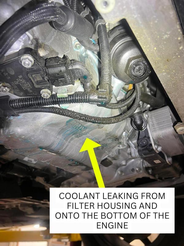coolant leaking from filter housing and onto the bottom of the engine